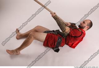 MARCUS LAYING POSE WITH SPEAR